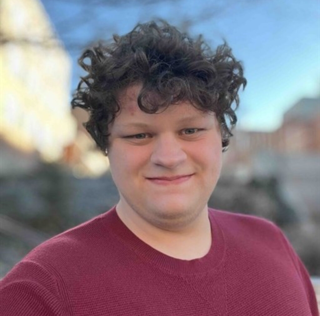 Hayden LaCelle standing in front of Fulmer Hall at Washington State University.